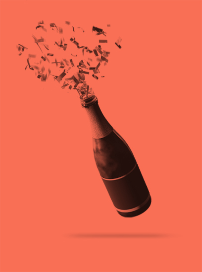 Confetti flying out of a champagne bottle.